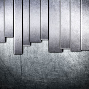 Brushed stainless steel flat bars in varying lengths against a textured metal background